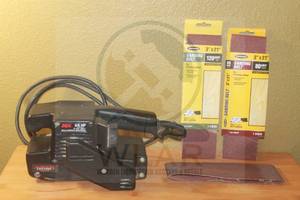 lot 219 image: SKIL 7313 BELT SANDER WITH 3- SANDING BELTS&nbsp