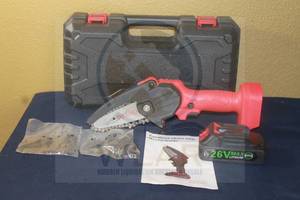 lot 271 image: CORDLESS MINI&nbsp PORTABLE ELECTRIC CHAINSAW WITH BATTERY &amp CARRY CASE AND 2-&nbsp 14 428&nbsp CHAIN SAW CHAINS&nbsp