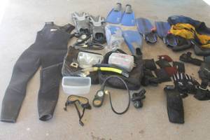 lot 307 image: COLLECTION OF SCUBA DIVING EQUIPMENT , TILOS WET SUIT,SNORKELING FINS,DIVING REGULATORS, SNORKELING MASKS , MESH CATCH BAGS, SANDLESS SANDBAGS&nbsp AND MORE SEE PICS&nbsp