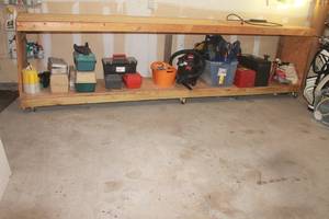 lot 320 image: LONG WOODEN WORKBENCH WITH UNDERNEATH SHELF ON CASTERS&nbsp  GREAT FOR WORKSHOP GARAGE SHED  12 FT L X 26D X 46H  CONTENTS NOT INCLUDED SEE PICS  BRING HELP&nbsp
