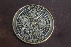 lot 183 image: U.S MILITARY THANK YOU FOR YOUR SERVICE COIN , FEATURES THE SEALS OF US MARINE CORPS, NAVY, ARMY,AIR FORCE AND COAST GUARD AROUND A CENTRAL STAR&nbsp