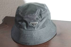 lot 118 image: PRADA MILANO RE-NYLON BLACK BUCKET HAT&nbsp