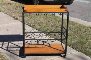 lot 156 image: SOLID WOOD &amp METAL FIVE RACKS FOR STEM WINECHAMPAGNE GLASS&nbsp STORAGE &amp TEN BOTTLE&nbsp STORAGE&nbsp WITH TOP SERVING HANDLE TRAY &amp ICE BUCKET BOTTOM STORAGE&nbsp MOBILE BAR CART WITH LOCKING CASTERS , 28 L X 16 W X 30H&nbsp