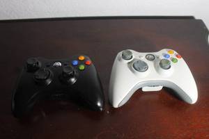 lot 42 image: TOTAL OF 2 XBOX 360 WIRELESS BLACKWHITE&nbsp CONTROLLERS&nbsp