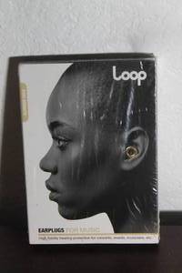 lot 125 image: LOOP EARPLUGS FOR MUSIC IN GLORIOUS GOLD IN SEALED CASE&nbsp