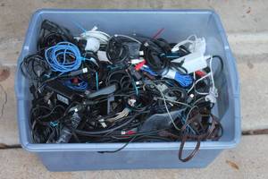 lot 11 image: GENEROUS AMOUNT OF ASSORTED POWER SUPPLY CORDS , HDMI CORDS, RCA JACKS AND MORE SEE PICS , TOTE INCLUDED