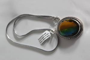 lot 44 image: GERMAN SILVER NECKLACE WITH AMETRINE CRYSTAL PENDENT&nbsp