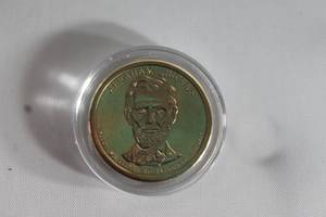 lot 55 image: PRESIDENT DOLLAR COIN ABRAHAM LINCOLN 1861-1865