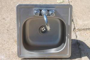 lot 6 image: Kindred stainless steel drop-in single basin sink with a chrome gooseneck faucet assembly.