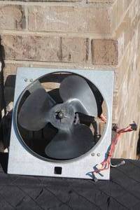 lot 14 image: Advanced Air Mfg. attic or ventilation exhaust fan with a square galvanized metal frame and black three-blade impeller.