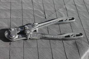 lot 17 image: Vintage Nicopress hand crimping tool with cast metal handles, showing light cosmetic wear from age and use.e.