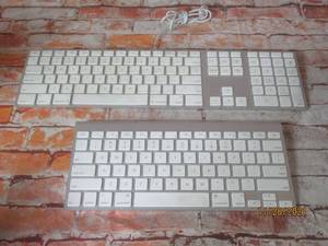 lot 58 image: 2 APPLE KEYBOARDS A1255 AND A1243