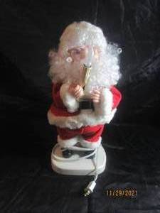 lot 115 image: TABLE TOP SANTAS BEST TABLE TOP ELECTRIC SANTA