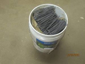 lot 170 image: GENEROUS AMOUNT (5 GALLON BUCKET FULL) U TENT PEGS BUCKET INCLUDED