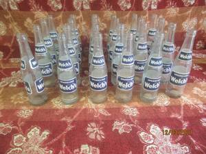 lot 106 image: VINTAGE WELCHS SPARKLING SODA BOTTLES  24