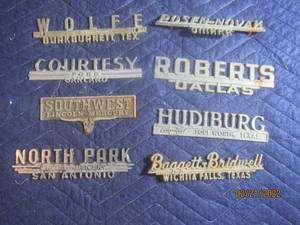 lot 78 image: VINTAGE METAL DEALERSHIP EMBLEM BADGES  LOT OF 8.