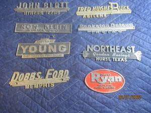 lot 84 image: VINTAGE METAL DEALERSHIP EMBLEM BADGES  LOT OF 8.
