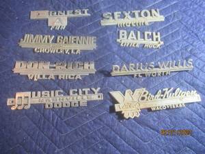 lot 87 image: VINTAGE METAL DEALERSHIP EMBLEM BADGES  LOT OF 8.