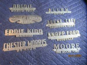 lot 90 image: VINTAGE METAL DEALERSHIP EMBLEM BADGES  LOT OF 8.