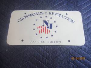 lot 167 image: VINTAGE 197577 US BICENTENNIAL COMMEMORATIVE BOOSTER CROSSROADS OF THE REVOLUTION NEW JERSEY LICENSE PLATE
