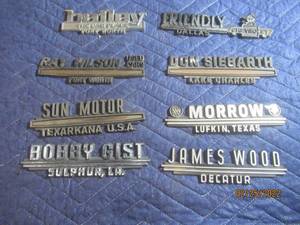 lot 205 image: VINTAGE PLASTIC DEALERSHIP EMBLEM BADGES LOT OF 8.
