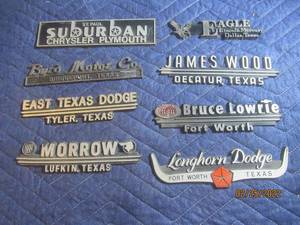 lot 206 image: VINTAGE PLASTIC DEALERSHIP EMBLEM BADGES LOT OF 8.