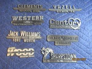 lot 209 image: VINTAGE PLASTIC DEALERSHIP EMBLEM BADGES LOT OF 8.