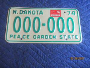 lot 239 image: VINTAGE 1974 NORTH DAKOTA SAMPLE LICENSE PLATE