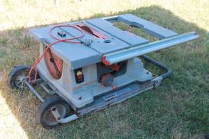 lot 6 image: RIGID WORK N HAUL IT 10 TABLE SAW WITH FOLDING ROLLING STAND