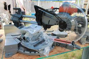 lot 53 image: NEW RIDGID R4221 12 DOUBLE BEVEL SLIDING COMPOND MITER SAW&nbsp
