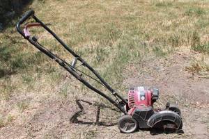 lot 102 image: TROY- BILT 4 CYCLE TB516EC WHEELED EDGER&nbsp