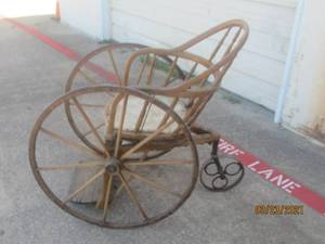 lot 5 image: ANTIQUE WOODEN 3 WHEEL WHEELCHAIR BY FORD JOHNSO CO.