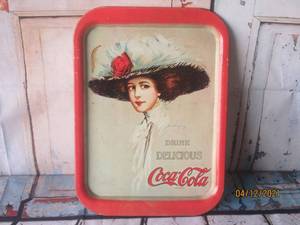 lot 101 image: COCA COLA DRINK DELICIOUS 1909 GIRL&nbsp SERVING TIN TRAY SIGNED&nbsp HAMILTON&nbsp KING&nbsp
