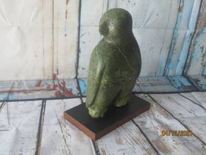 lot 103 image: INUIT CURIOUS OWL HEAVY STATUE ON WOOD PLAQUE&nbsp