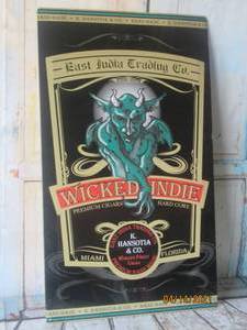 lot 217 image: WICKED INDIE PREMIUM CIGARS &amp METAL ADVERTISING SIGN&nbsp K. HANSOTIA &amp Co EAST INDIA TRADING&nbsp