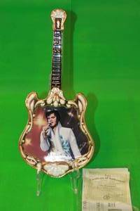 lot 49 image: ELVIS PRESLEY   THE PERFORMER  THIRTEENTH ISSUE IN ENTERTAINER OF THE CENTURY GUITAR PLATE No A1047, WITH COA , 13