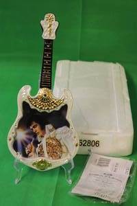 lot 51 image: ELVIS PRESLEY 1977,THE DREAM , SIXTH ISSUE IN ENTERTAINER OF THE CENTURY , GUITAR PLATE No A03598,W ITH COA ,13