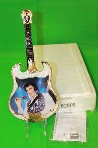 lot 53 image: ELVIS PRESLEY 1975,THE PHOENIX , FIFTH ISSUE IN ENTERTAINER OF THE CENTURY , GUITAR PLATE No A09974, WITH COA ,13