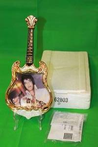 lot 54 image: ELVIS PRESLEY 1974,THE SUPER STAR ,THIRD ISSUE IN ENTERTAINER OF THE CENTURY,GUITAR PLATE No A03180,WITH COA,13