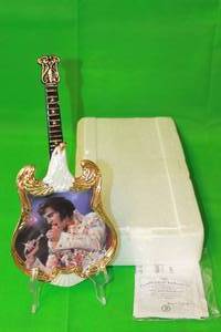 lot 55 image: ELVIS PRESLEY  1973,ALOHA FROM HAWAII  FIRST ISSUE IN ENTERTAINER OF THE CENTURY ,GUITAR PLATE No AB772, WITH COA 13