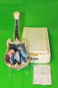 lot 56 image: ELVIS PRESLEY THE INSPIRATION   NINTH  ISSUE IN ENTERTAINER OF THE CENTURY ,GUITAR PLATE No A01576, WITH COA 13
