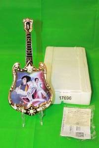 lot 57 image: ELVIS PRESLEY  A TRIBUTE  SIXTEENTH ISSUE IN ENTERTAINER OF THE CENTURY, GUITAR PLATE No A0397,WITH COA,13