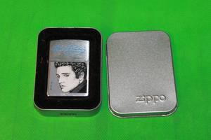 lot 62 image: ELVIS PRESLEY , VINTAGE ZIPPO LIGHTER WITH ORIGINAL BOX