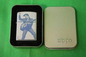 lot 63 image: ELVIS PRESLEY,VINTAGE ZIPPO LIGHTER WITH ORIGINAL BOX