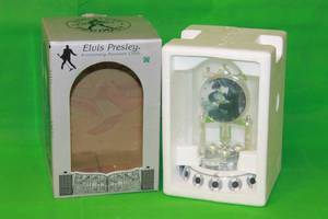 lot 66 image: ELVIS PRESLEY, ANNIVERSAY PORCELAIN BASE ,GLASS DOME REVOLVING PENDULUM CLOCK ,9H ,( IN ORIGINAL BOX )