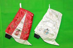 lot 70 image: TOTAL OF 2 , ELVIS PRESLEY CHRISTMAS MUSICAL SATIN BOOT STOCKING DECORATION 17