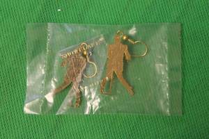 lot 76 image: ELVIS PRESLEY, GOLD TONE , ELVIS PERFORMING DANGLE EARRINGS (NEVER WORN)