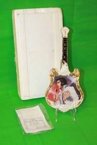 lot 112 image: ELVIS PRESLEY 1971,THE VISION SEVENTH ISSUE IN ENTERTAINER OF THE CENTURY GUITAR PLATE No A01899,WITH COA, 13 H