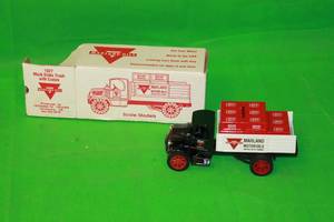 lot 27 image: MARLAND OILS 1927 MACK DIE CAST METAL LOCKING COIN BANK