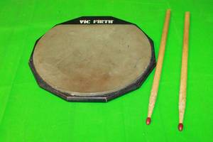 lot 106 image: VIC FIRTH SINGLE SIDED PRACTICE SNARE DRUM PAD 13 WITH AMERICAN CLASSIC DRUM STICKS